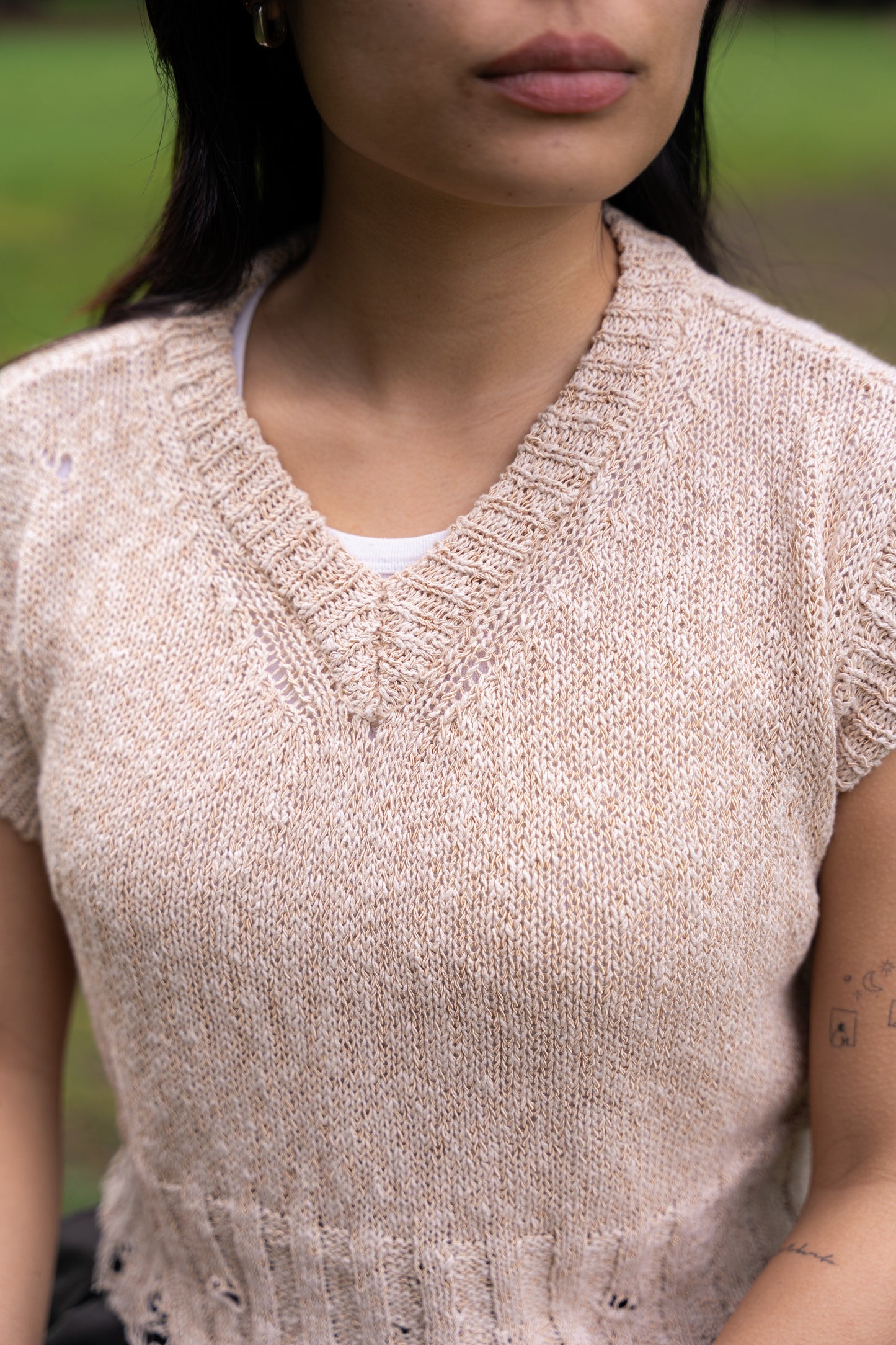 
                  
                    Distressed V-neck vest- Beige
                  
                