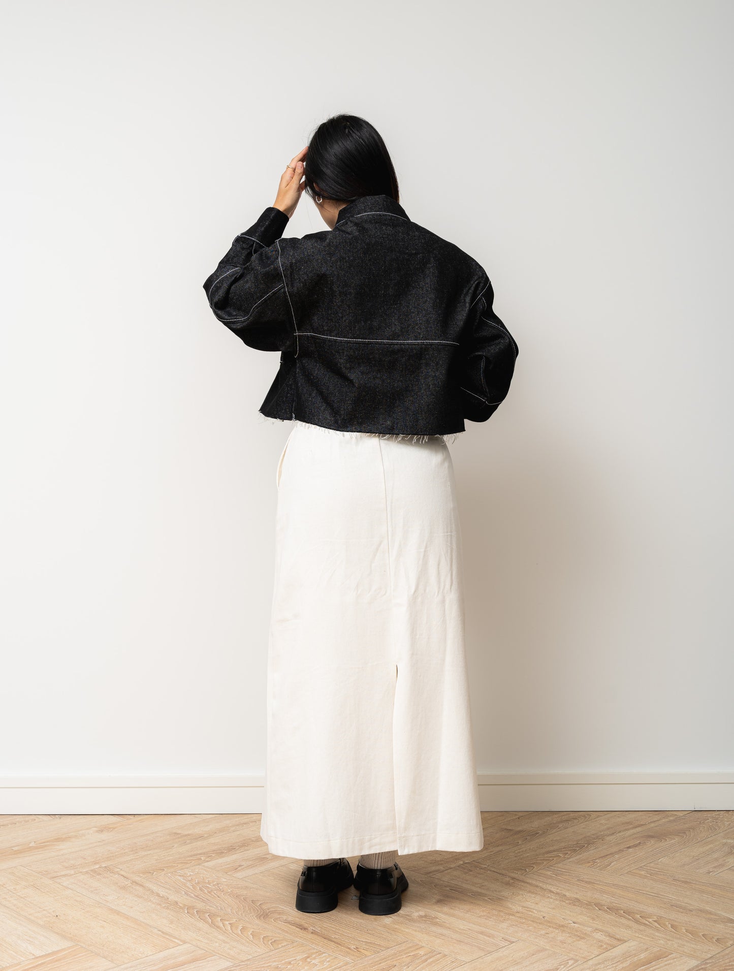
                  
                    Black Denim Cropped Jacket with White Stitch
                  
                